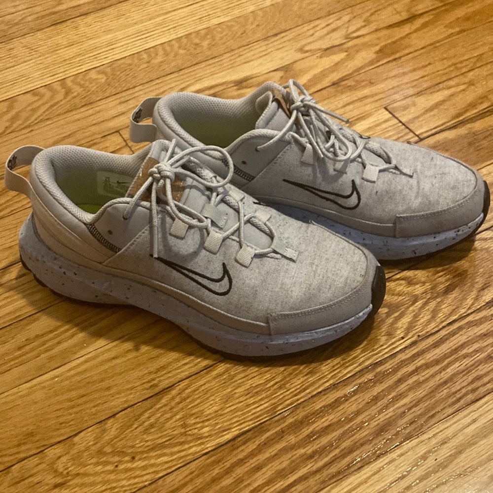 Gently used grey and blue Nike sneakers